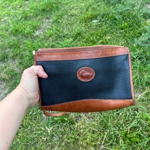 Dooney & Bourke Black and Brown Leather Wallet with Classic Design